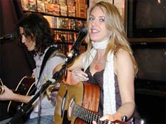 Liz Phair with Dino Meneghin at Sunrise Records in Toronto